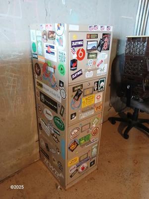 Metal filing cabinet - full of such cool local stickers