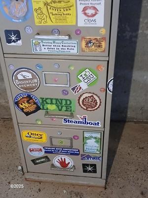 Metal filing cabinet - full of such cool local stickers