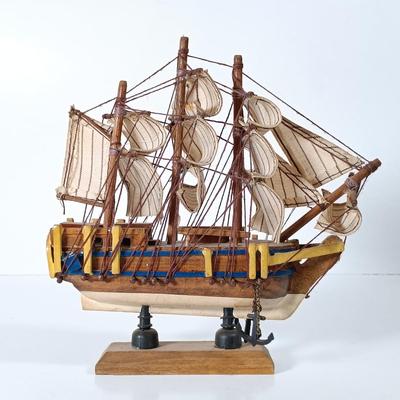 LOT 58D: Miniature Collectible Ships: Hard Resin Chesapeake Ship, Wood Confection Ship, Tybee Island Wood HMS Bounty & More