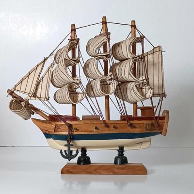 LOT 58D: Miniature Collectible Ships: Hard Resin Chesapeake Ship, Wood Confection Ship, Tybee Island Wood HMS Bounty & More