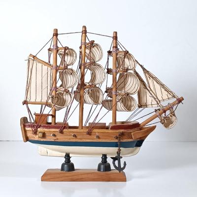 LOT 58D: Miniature Collectible Ships: Hard Resin Chesapeake Ship, Wood Confection Ship, Tybee Island Wood HMS Bounty & More