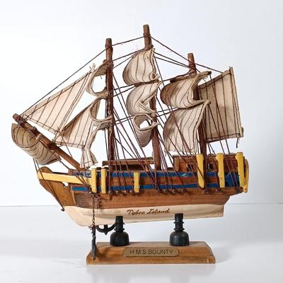LOT 58D: Miniature Collectible Ships: Hard Resin Chesapeake Ship, Wood Confection Ship, Tybee Island Wood HMS Bounty & More