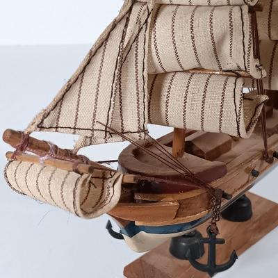 LOT 58D: Miniature Collectible Ships: Hard Resin Chesapeake Ship, Wood Confection Ship, Tybee Island Wood HMS Bounty & More