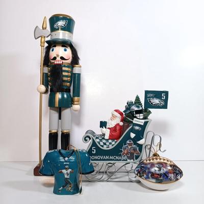 LOT 62D: NFL Christmas Collection Donovan McNabb Santa Sleigh, Memory Co. Philadelphia Eagles Nutcracker & More