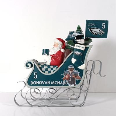 LOT 62D: NFL Christmas Collection Donovan McNabb Santa Sleigh, Memory Co. Philadelphia Eagles Nutcracker & More
