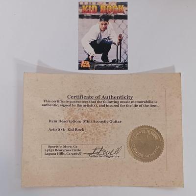 LOT 156B: Autographed Kid Rock Ukulele with COA, Autographed Four Aces Postacard & Kid Rock Novelty License Plate