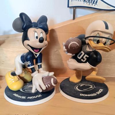 LOT 173B: The Danbury Mint Disney Penn State 9 Figurines with Display Shelf