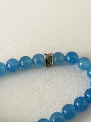 CFC. Marked blue beaded stretchy charm bracelet