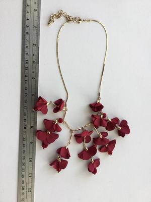 Beautiful red and gold tone flower statement necklace