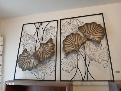 Two matching light metal wall art