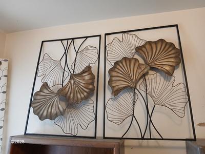 Two matching light metal wall art