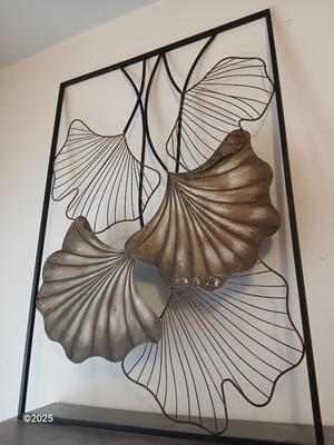 Two matching light metal wall art