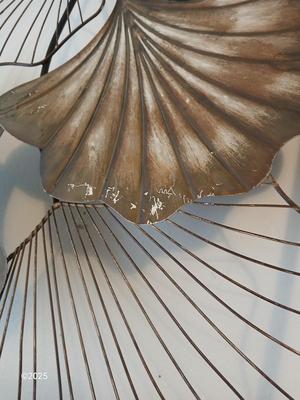 Two matching light metal wall art
