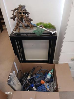 Ten gallon fish tank stand, led lit hood, and aquarium decorations, chemicals, and other fish items
