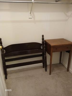Old sewing cabinet and a old wooden twin sized headboard and footboard