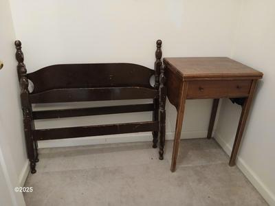 Old sewing cabinet and a old wooden twin sized headboard and footboard