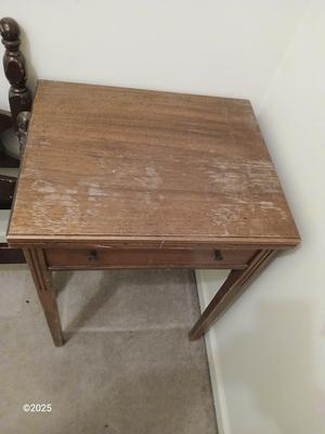 Old sewing cabinet and a old wooden twin sized headboard and footboard