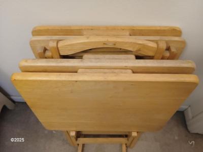 Four wooden T.V. Trays with storage rack