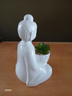 Ceramic buddha figure with Inhale Exhale canvas