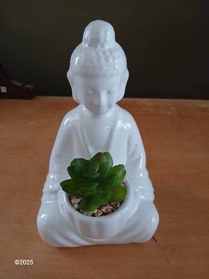 Ceramic buddha figure with Inhale Exhale canvas