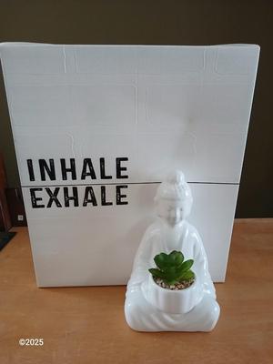 Ceramic buddha figure with Inhale Exhale canvas