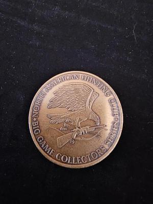 North American hunting Club books and a Collectors series coin