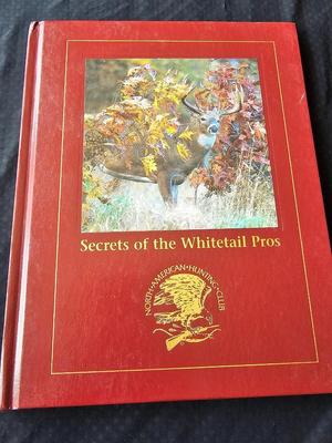 North American hunting Club books and a Collectors series coin
