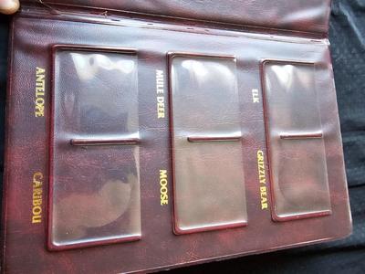 North American hunting Club books and a Collectors series coin
