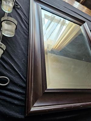 Framed mirror with two matching metal candle sconces / glass cups