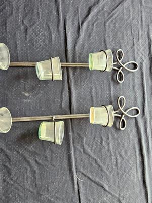 Framed mirror with two matching metal candle sconces / glass cups