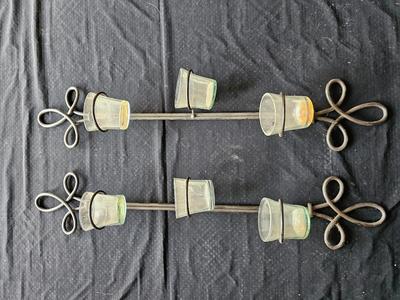 Framed mirror with two matching metal candle sconces / glass cups