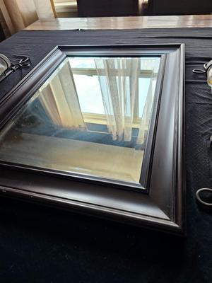 Framed mirror with two matching metal candle sconces / glass cups