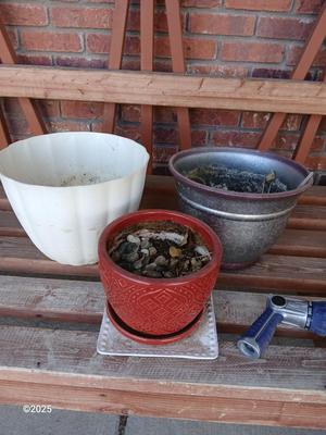 Three planters / flowerpots with a hose watering attachment