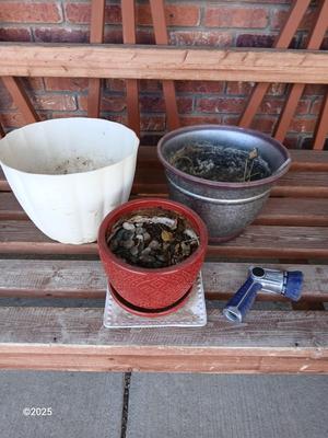 Three planters / flowerpots with a hose watering attachment