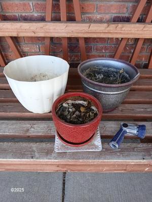 Three planters / flowerpots with a hose watering attachment