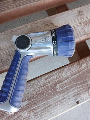 Three planters / flowerpots with a hose watering attachment