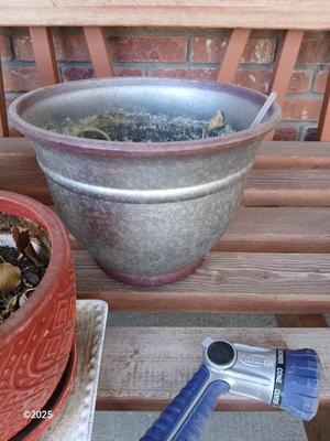 Three planters / flowerpots with a hose watering attachment
