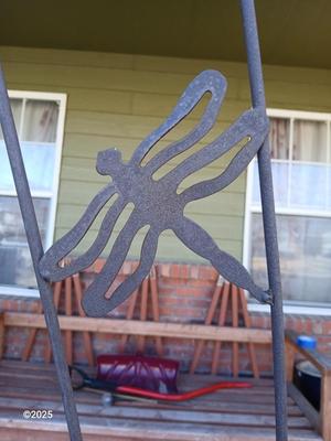 Neat handmade rustic plant stand with bowling ball center and a heavy metal Dragonfly Trellis
