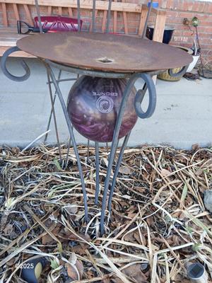 Neat handmade rustic plant stand with bowling ball center and a heavy metal Dragonfly Trellis