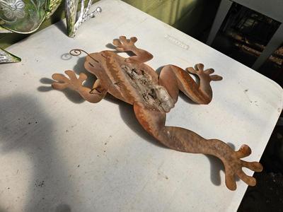 Four metal garden frogs and a strand of dragonfly lights