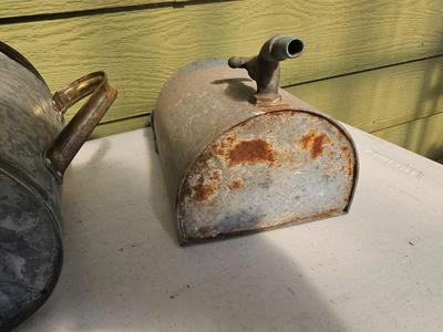Galvanized watering can, waterer with a pout, and three herb pots with a tray