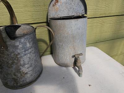 Galvanized watering can, waterer with a pout, and three herb pots with a tray