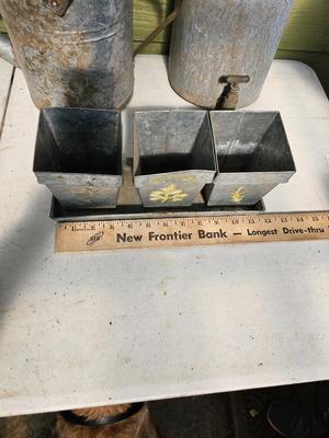 Galvanized watering can, waterer with a pout, and three herb pots with a tray