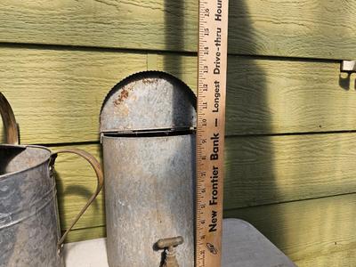 Galvanized watering can, waterer with a pout, and three herb pots with a tray