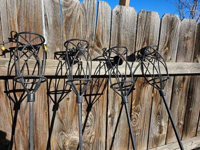Four metal tiki torches - Bamboo torches with a jug of tiki fuel