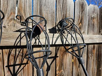 Four metal tiki torches - Bamboo torches with a jug of tiki fuel