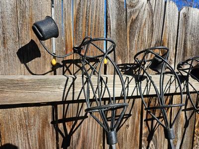 Four metal tiki torches - Bamboo torches with a jug of tiki fuel