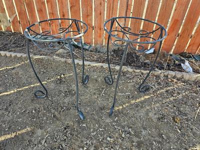 Two matching black metal plant stands