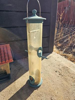 Grouping of Bird feeders and small wooden bird houses