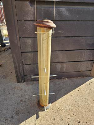Grouping of Bird feeders and small wooden bird houses